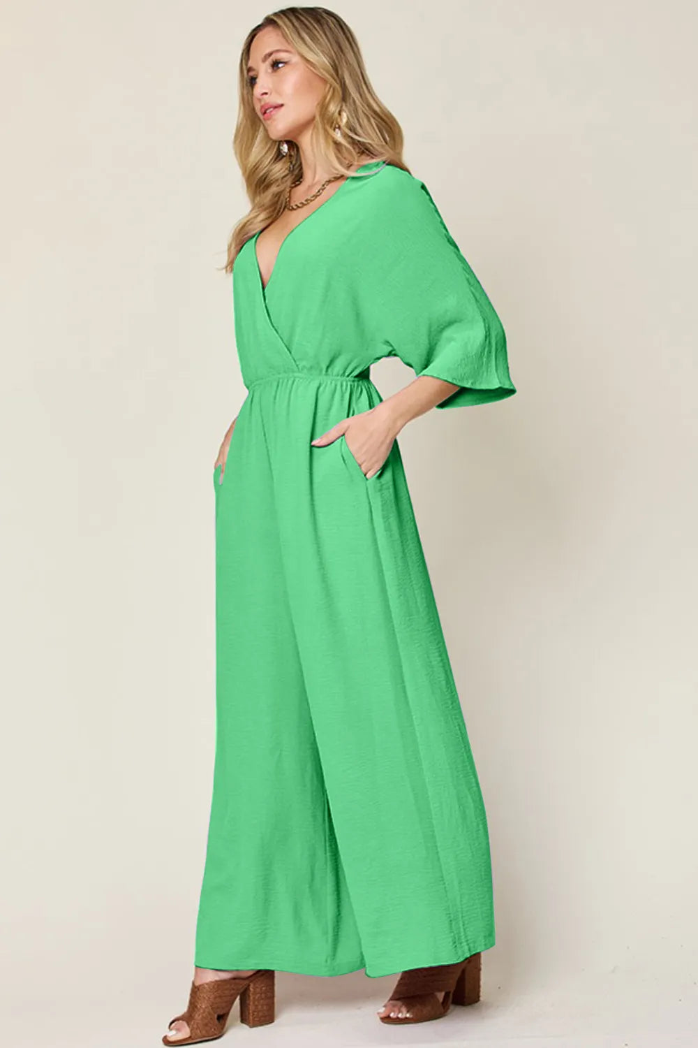 Double Take Full Size Surplice Wide Leg Jumpsuit with Pockets by Trendsi