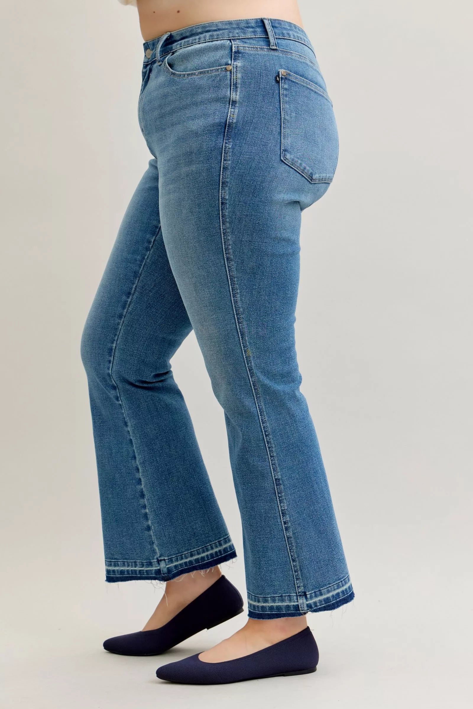 Judy Blue Full Size Mid Rise Slim Bootcut Tummy Control Release Hem Jeans Plus Size by Trendsi