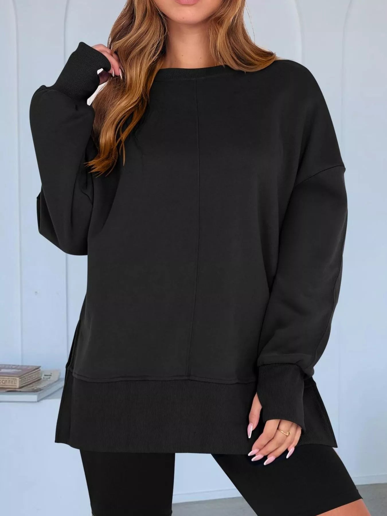 Side Slit Round Neck Long Sleeve Sweatshirt by Trendsi