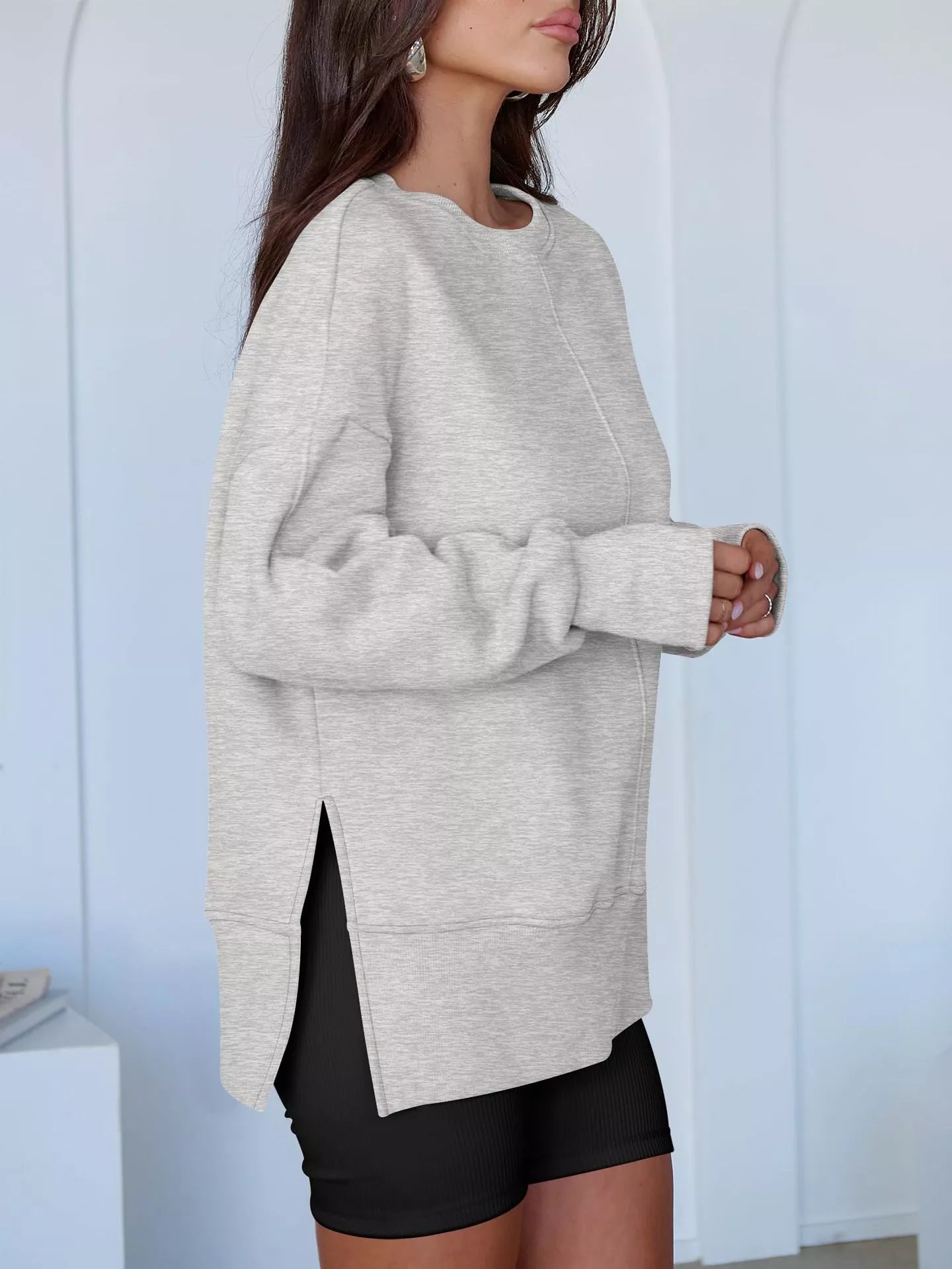 Side Slit Round Neck Long Sleeve Sweatshirt by Trendsi