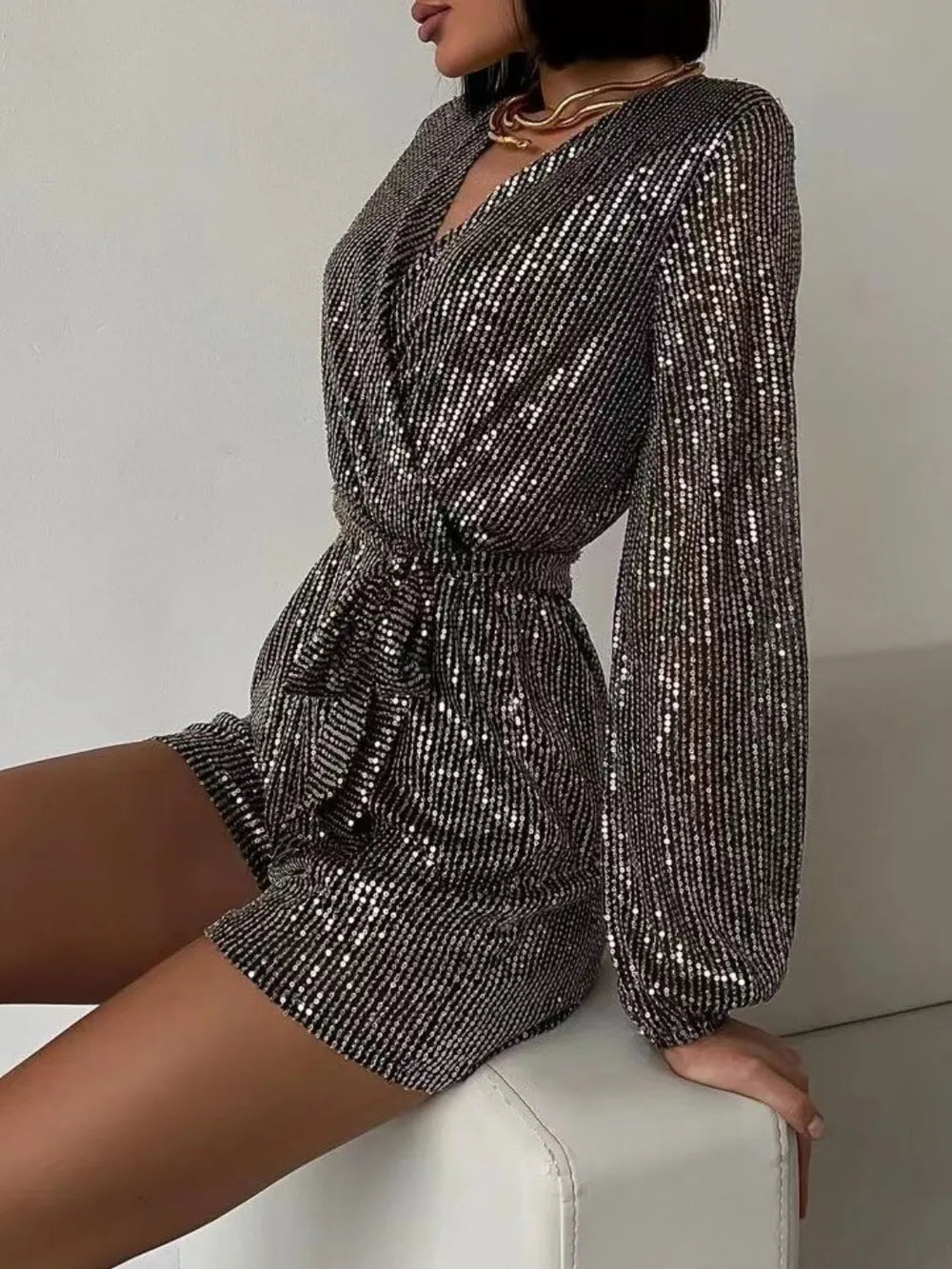 Full Size Sequin Surplice Tie Waist Long Sleeve Romper by Trendsi