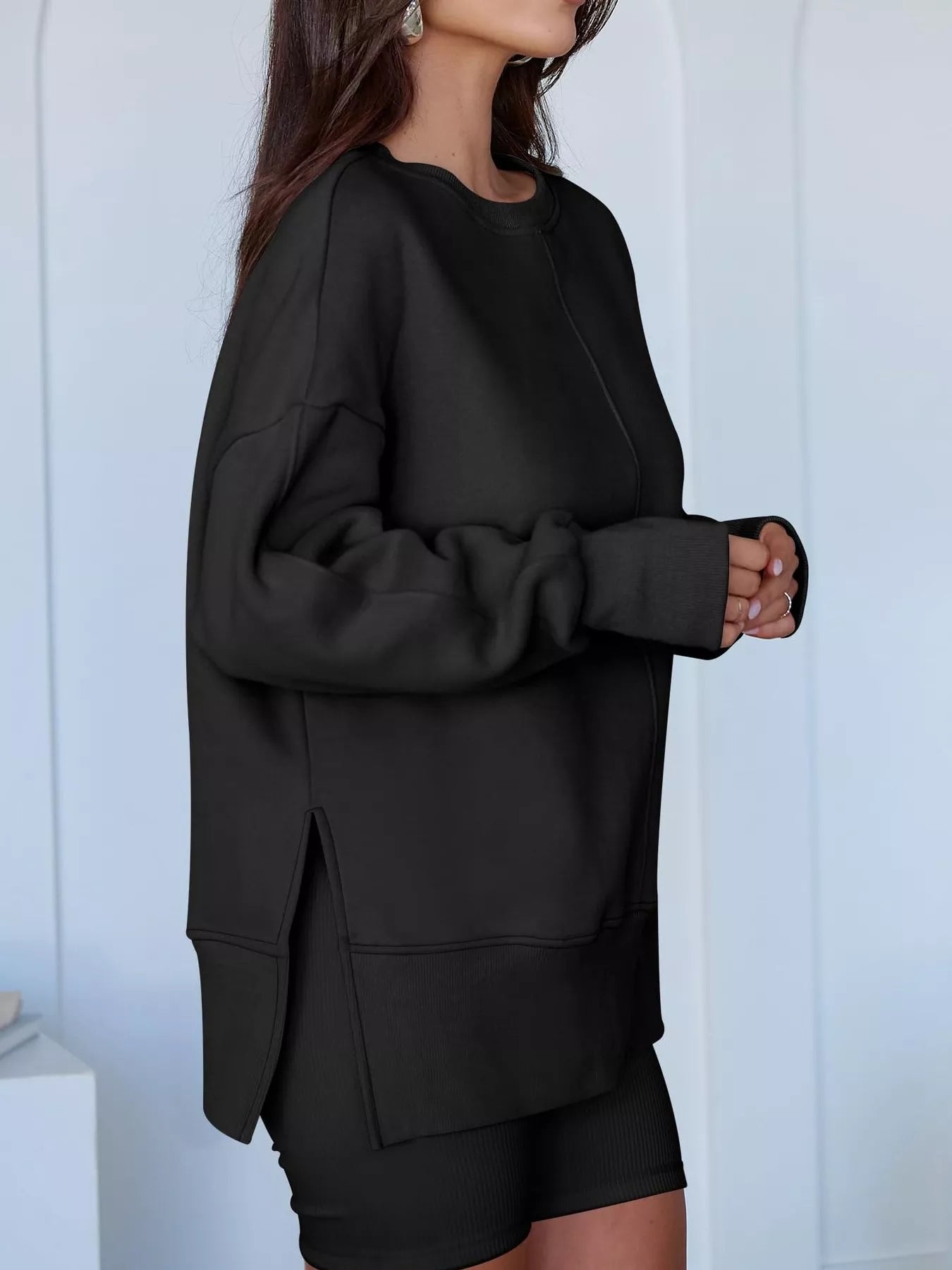 Side Slit Round Neck Long Sleeve Sweatshirt by Trendsi