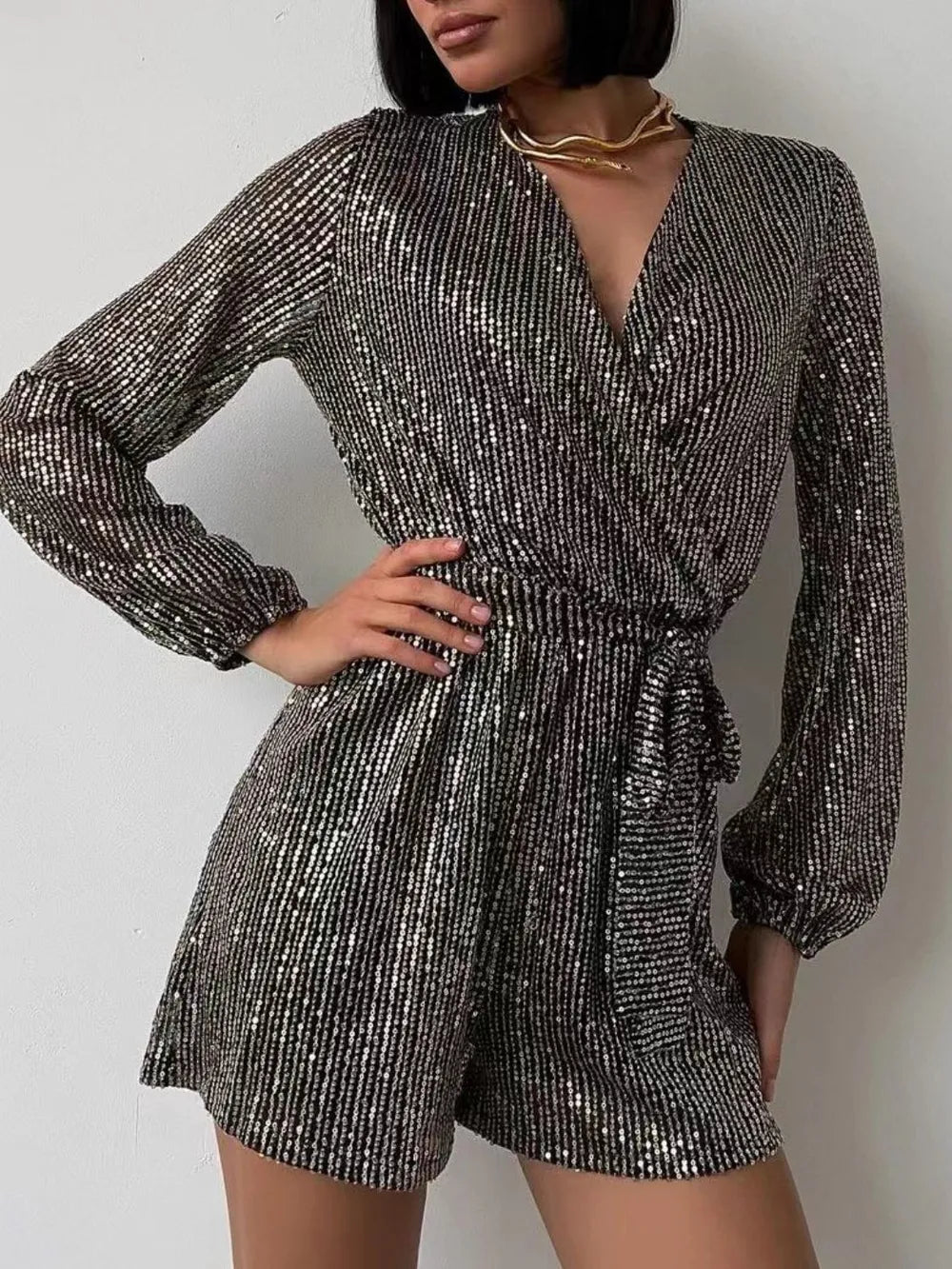 Full Size Sequin Surplice Tie Waist Long Sleeve Romper by Trendsi