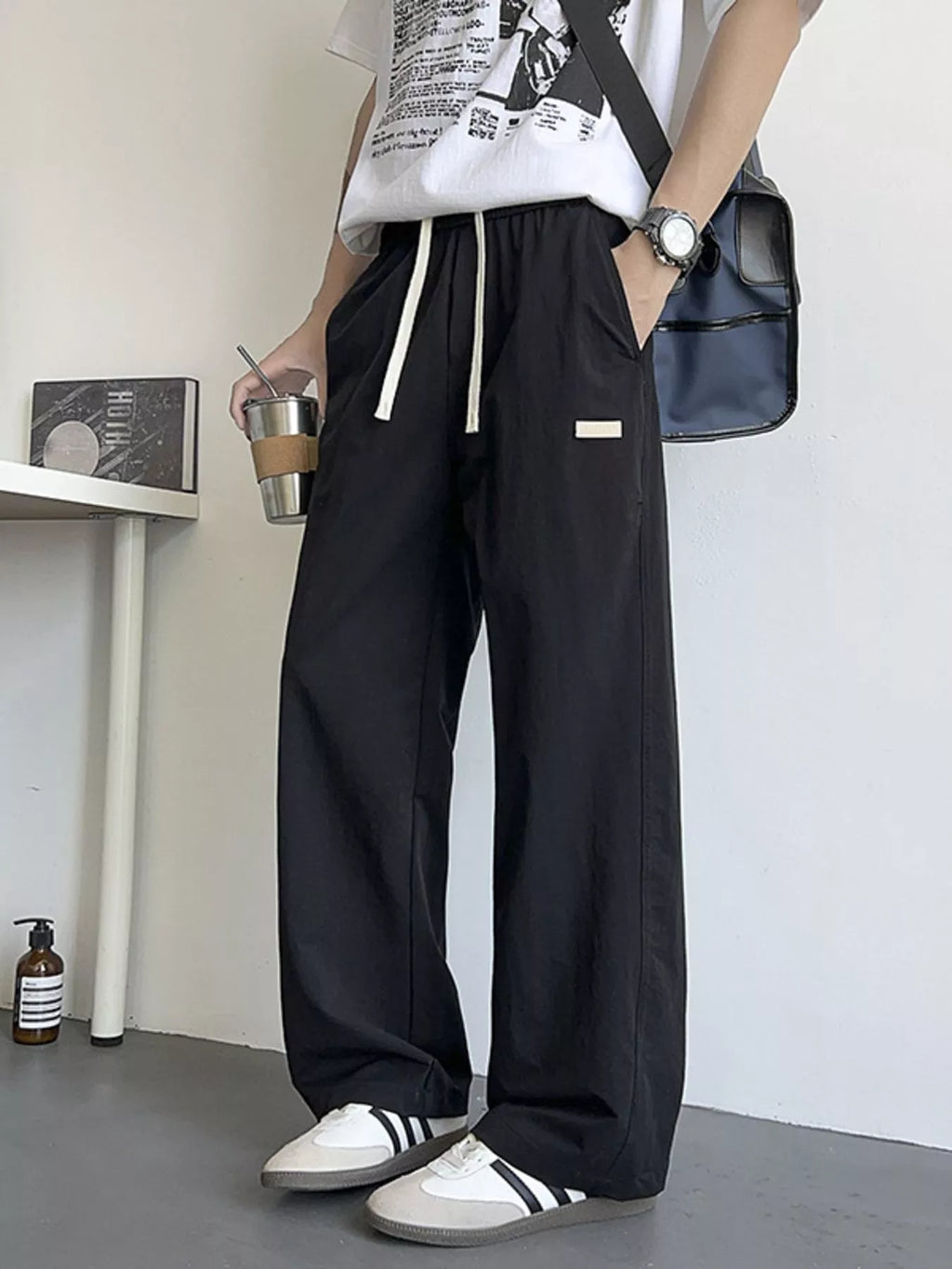 Men's Loose Fit Drawstring Casual Pants by Trendsi