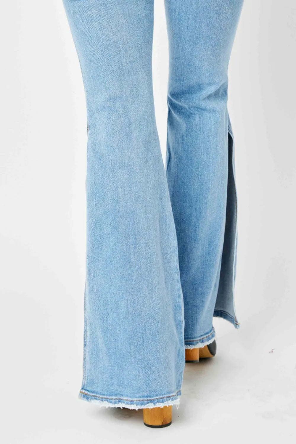 Judy Blue Full Size Mid Rise Raw Hem Slit Flare Jeans by Trendsi