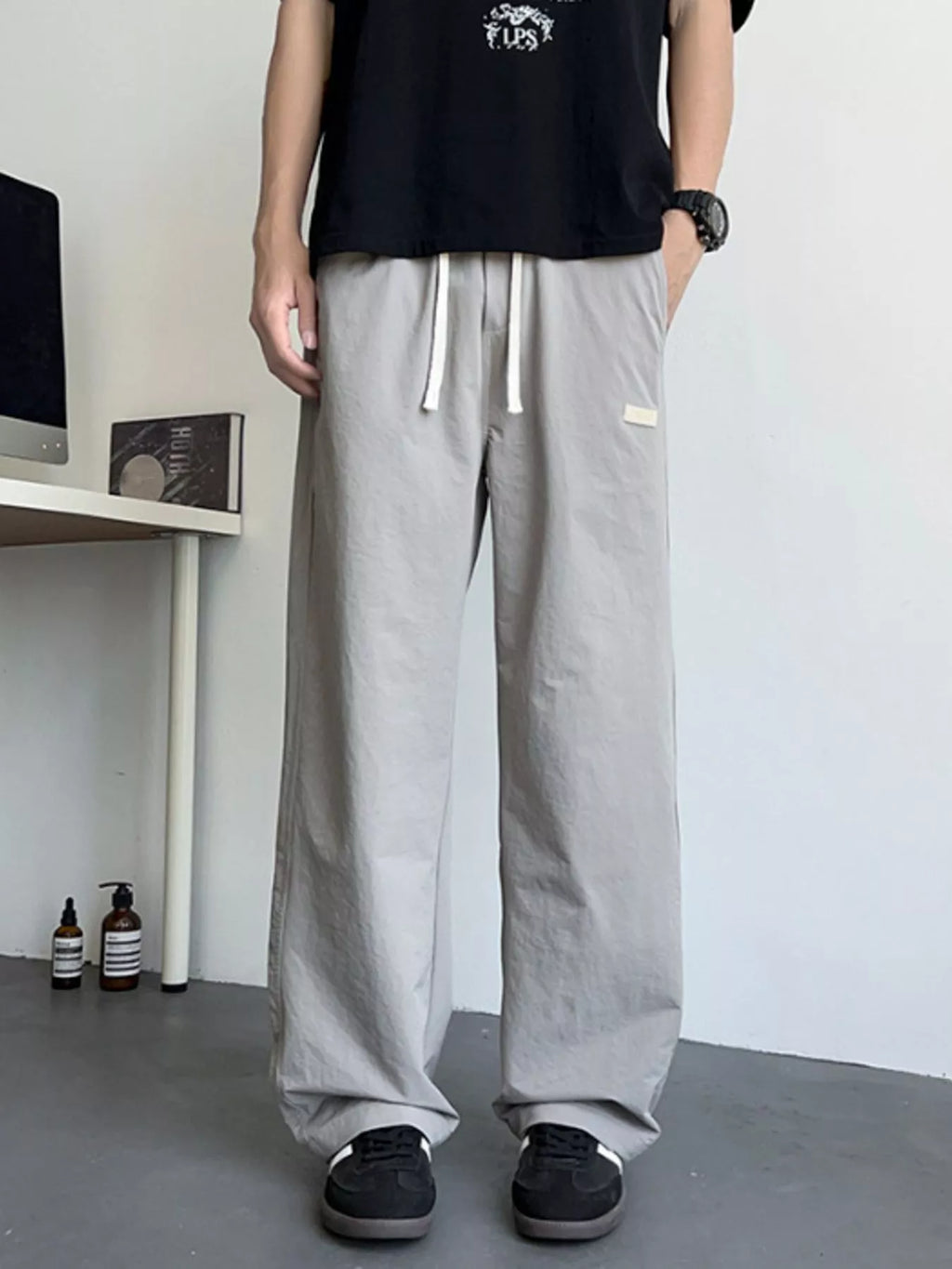 Men's Loose Fit Drawstring Casual Pants by Trendsi
