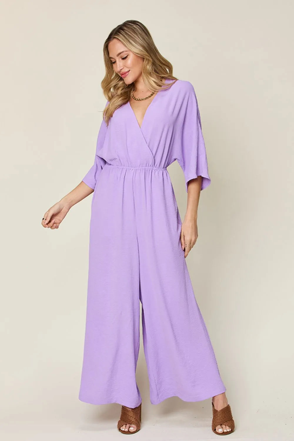 Double Take Full Size Surplice Wide Leg Jumpsuit with Pockets by Trendsi