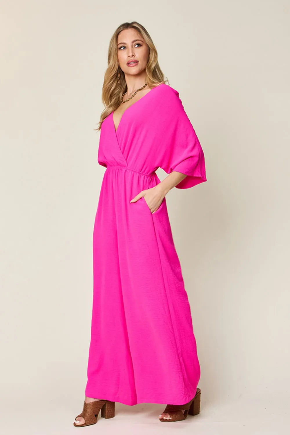 Double Take Full Size Surplice Wide Leg Jumpsuit with Pockets by Trendsi