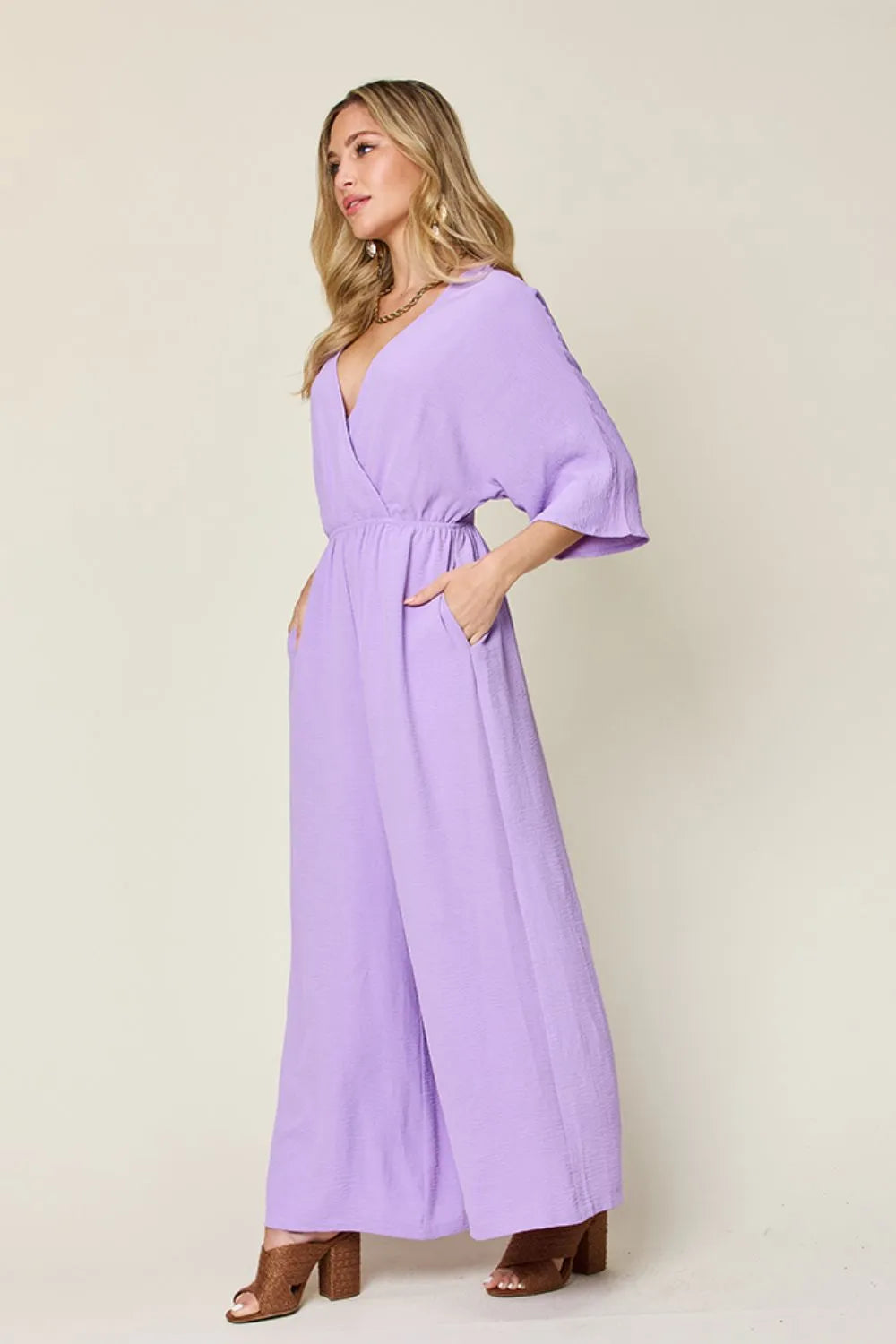 Double Take Full Size Surplice Wide Leg Jumpsuit with Pockets by Trendsi