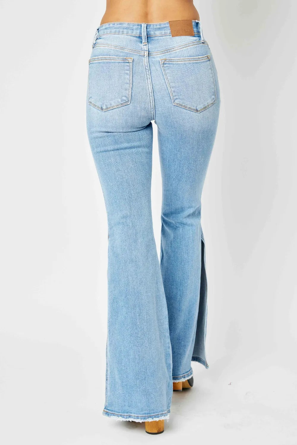 Judy Blue Full Size Mid Rise Raw Hem Slit Flare Jeans by Trendsi